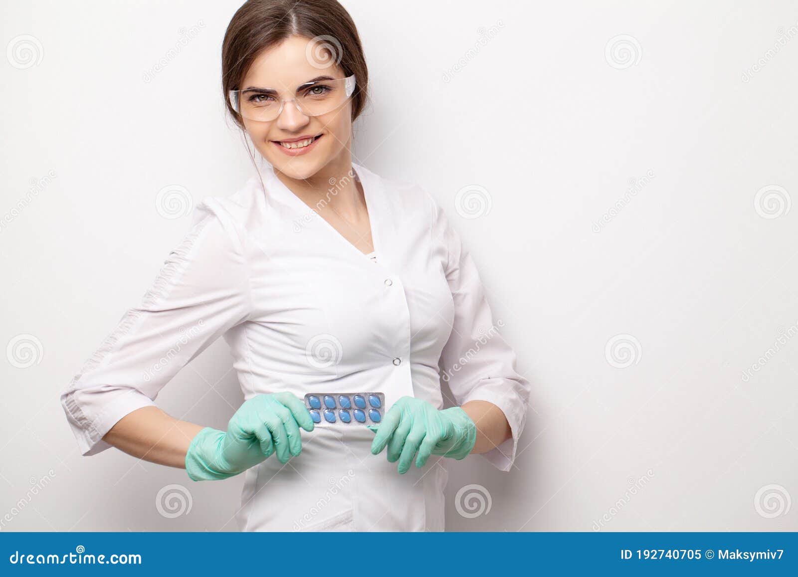 Sexual Health, a Doctor in a White Coat Holding a Pill for a Healthy Sex Life of Men Stock Image pic