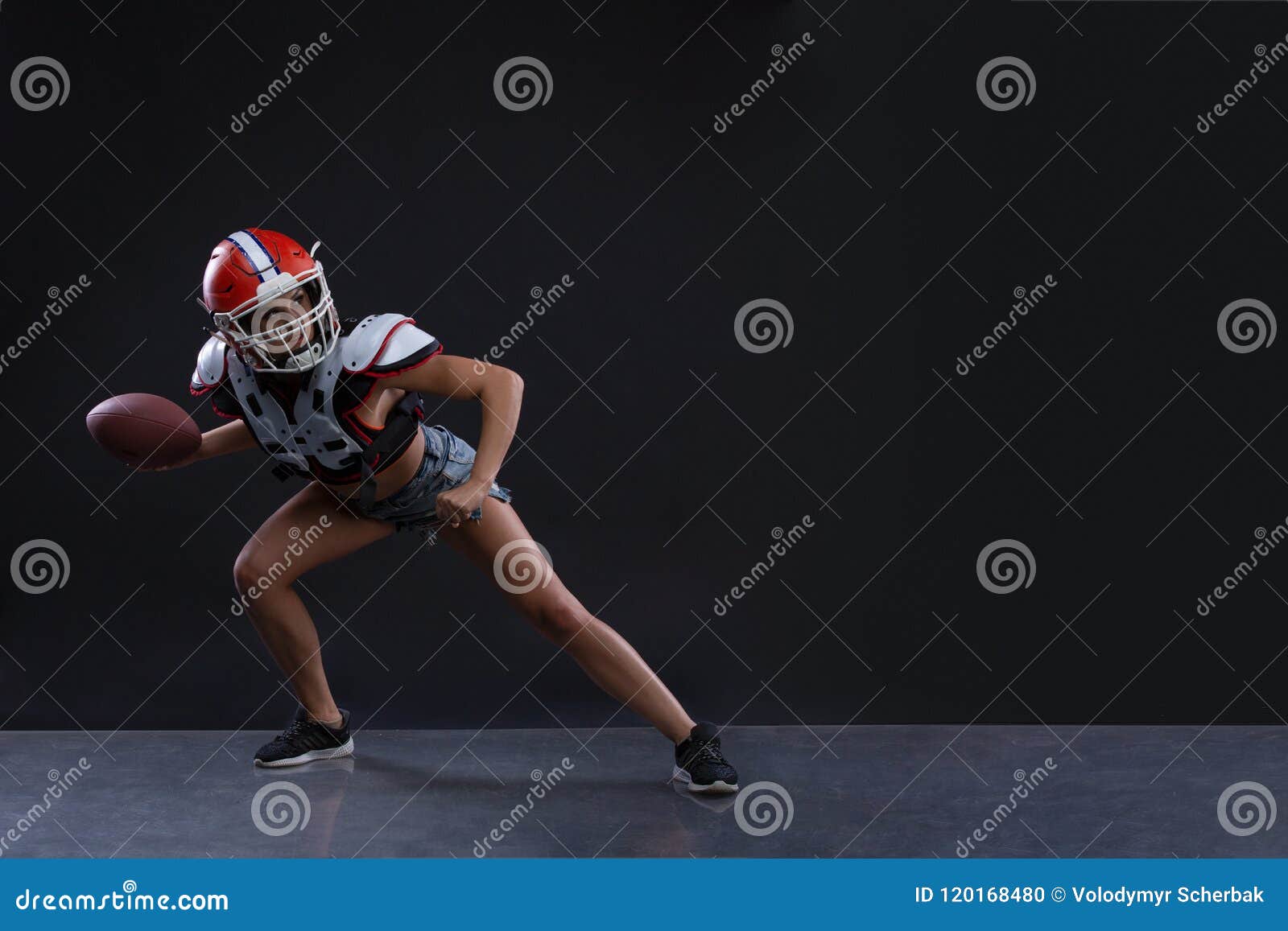 Sexual Sportive Woman Running with Rugby Ball and Screaming Aggressively at Black Background