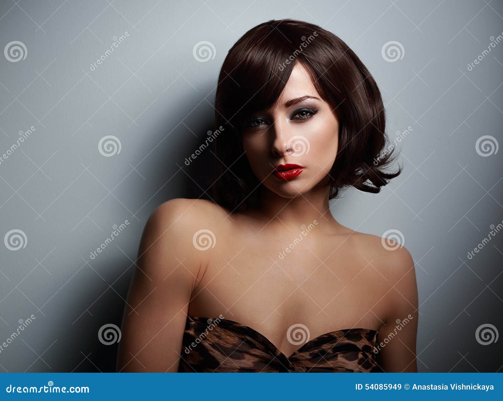 Sexual Woman with Black Short Hair Looking on Dark Background Stock Image pic