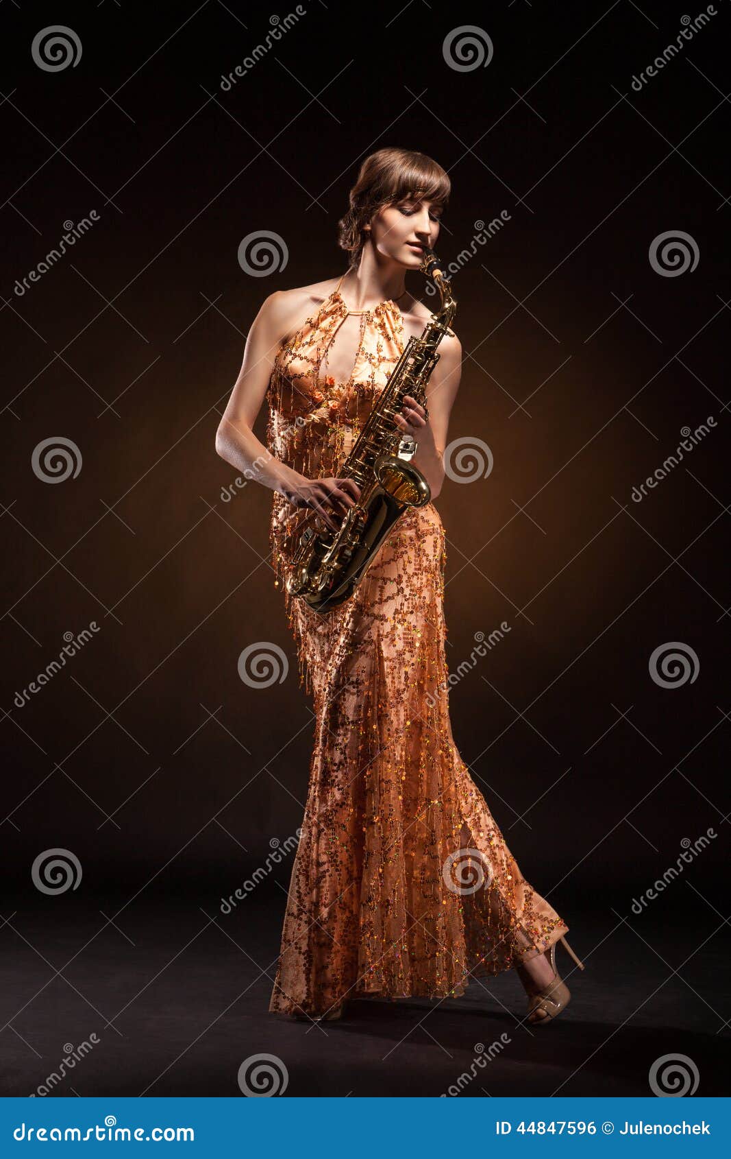 Jazz music. Portrait of a sexual young woman posing with 