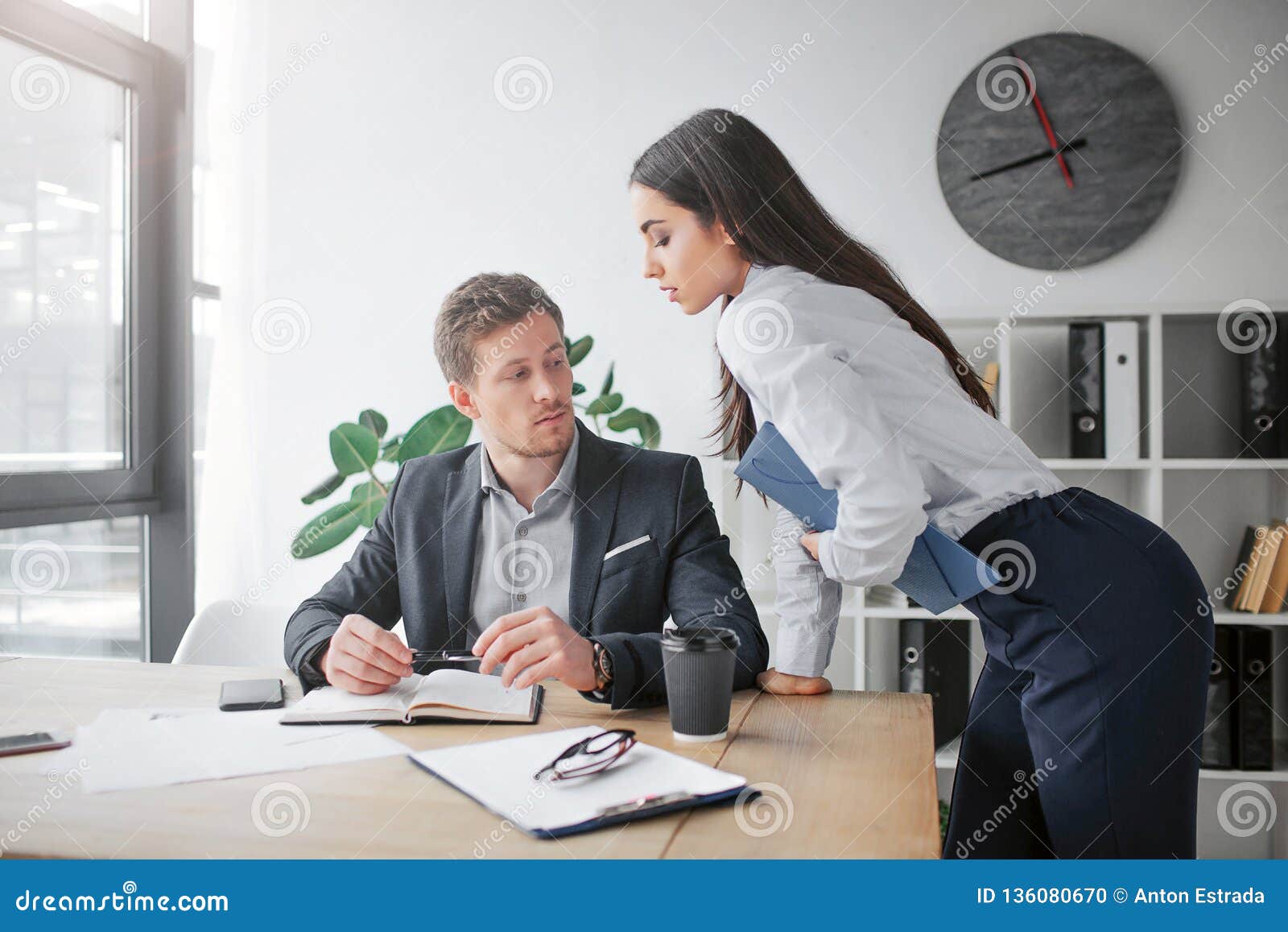 Sexual Young Woman Lean To Table. she Looks at Her Boss. Young Man