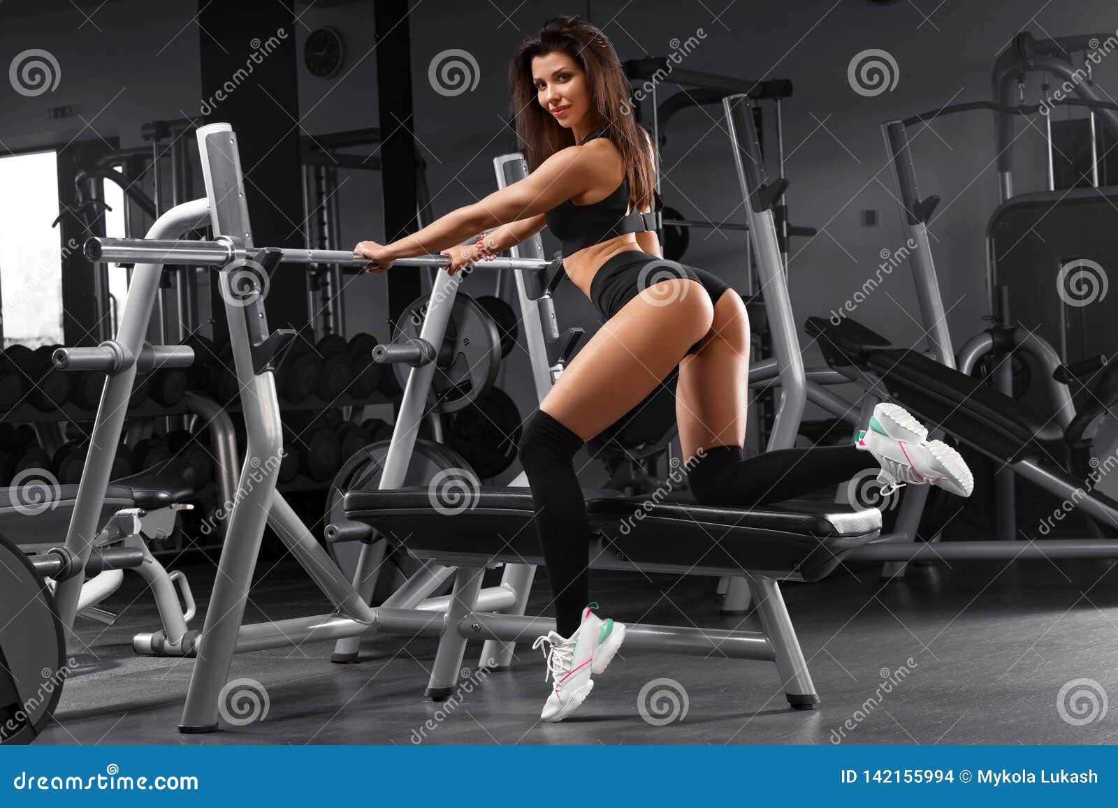 Athletic Girl Working Out in Gym. Buttocks in Thong Stock Photo
