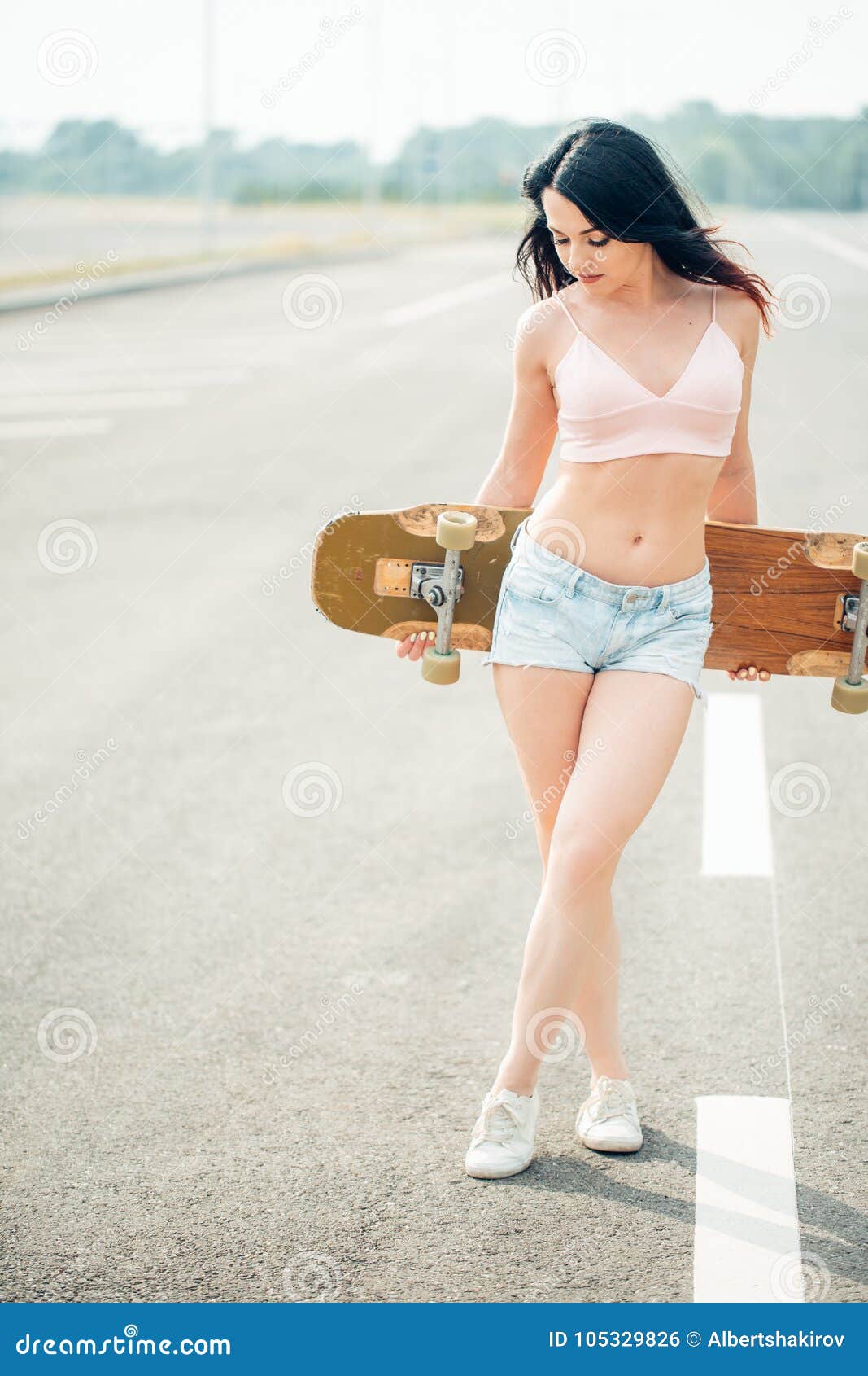 Happy Beautiful Brunette Girl Hold Her Wooden Longboard Skateboard In