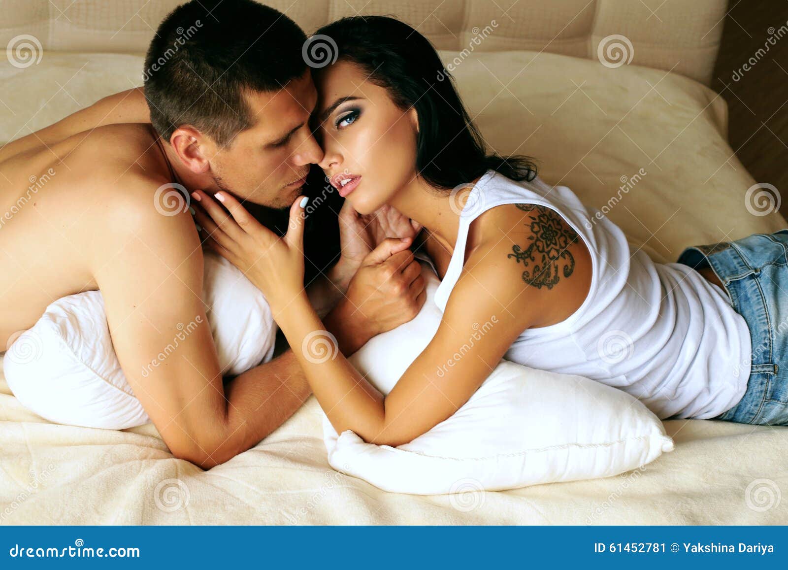 Beautiful Impassioned Couple Relaxing In Bed At The Hotel