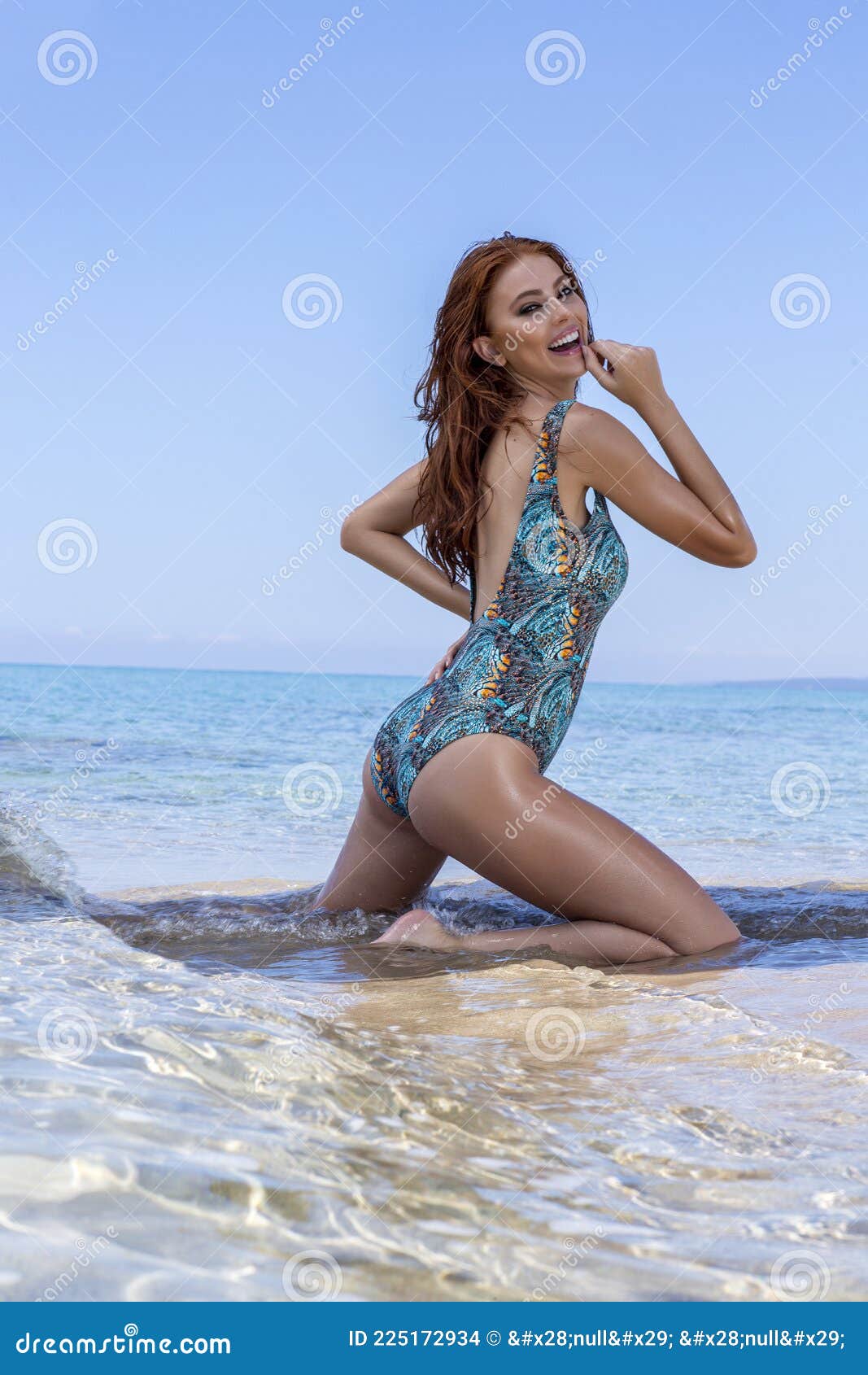 a beautiful brunette model in a green swimsuit, dark glasses and a hat poses  in front of the camera. 7116304 Stock Photo at Vecteezy