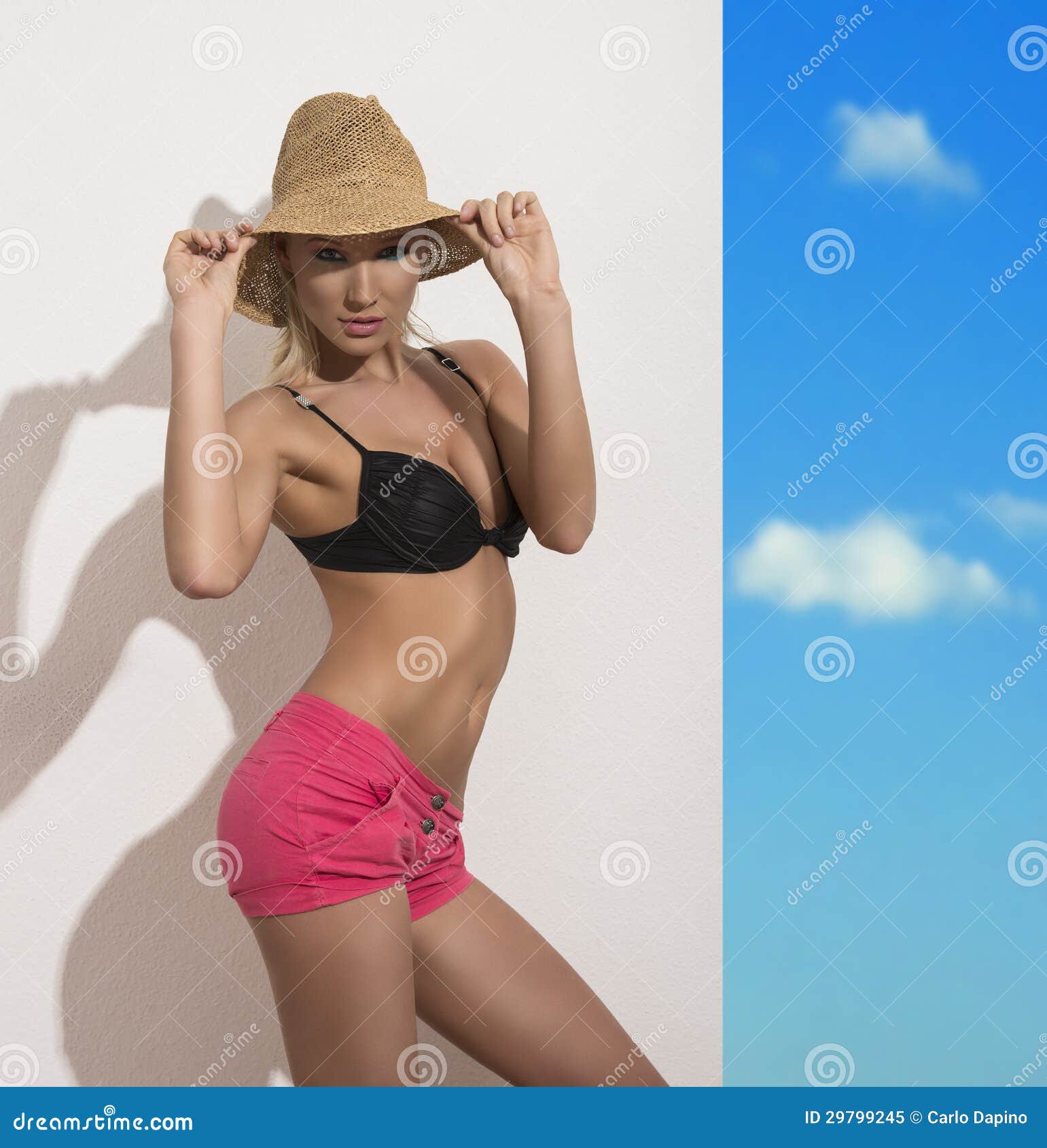 https://thumbs.dreamstime.com/z/sexy-blonde-girl-straw-hat-black-bra-pink-shorts-looks-to-lens-touches-hat-both-hands-29799245.jpg