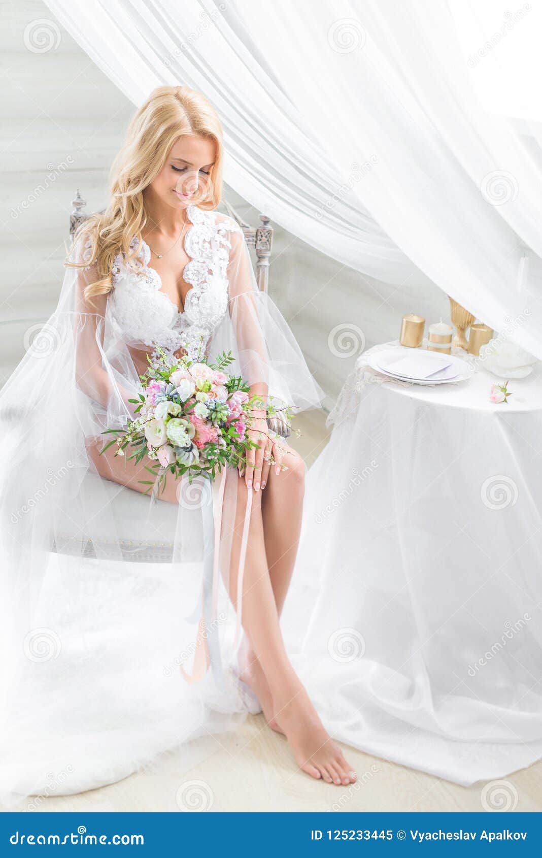 blonde in transparent clothing looking smilingly