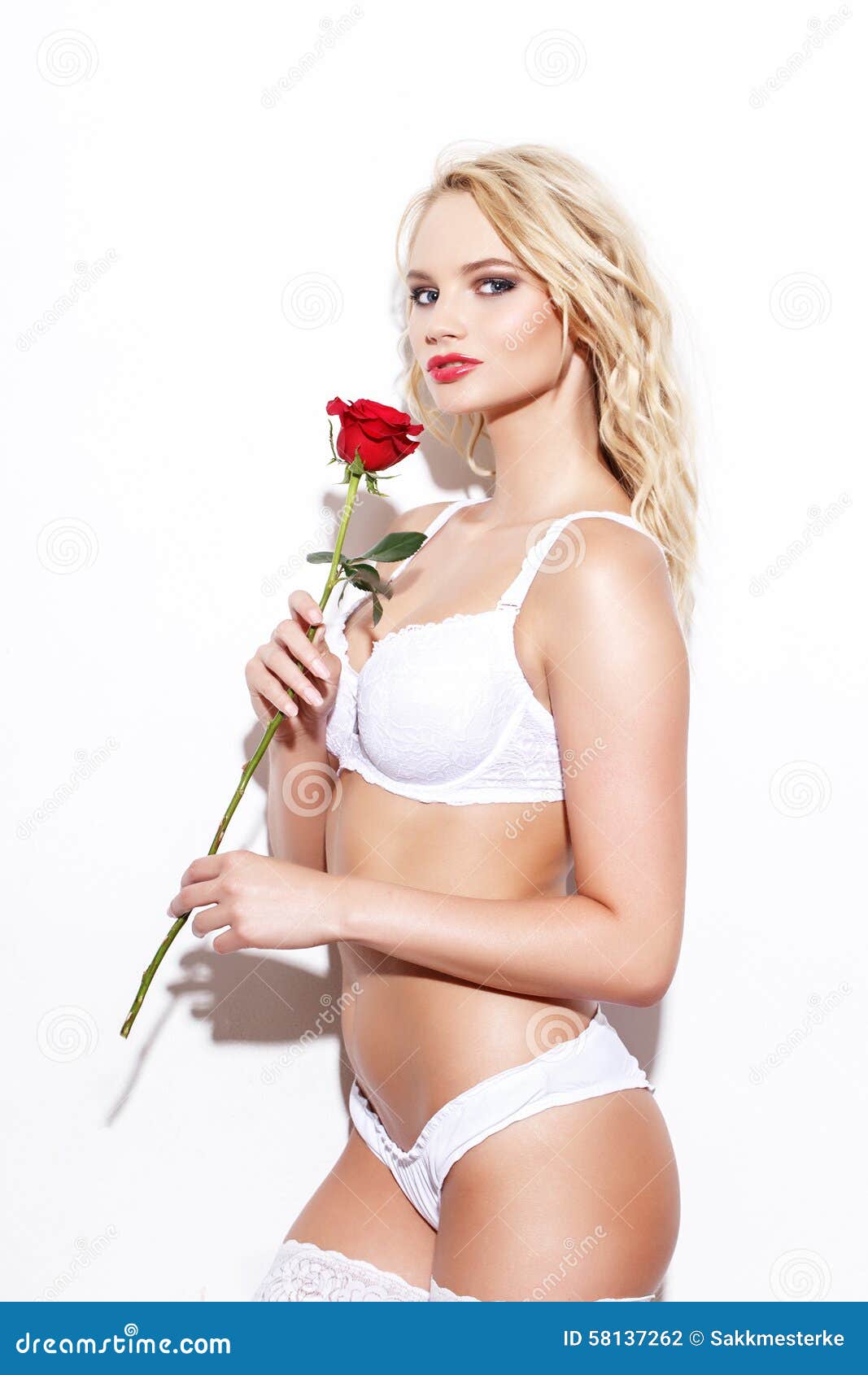 Young girl in white panties on wall background Stock Photo by ©kornilaev  50416575
