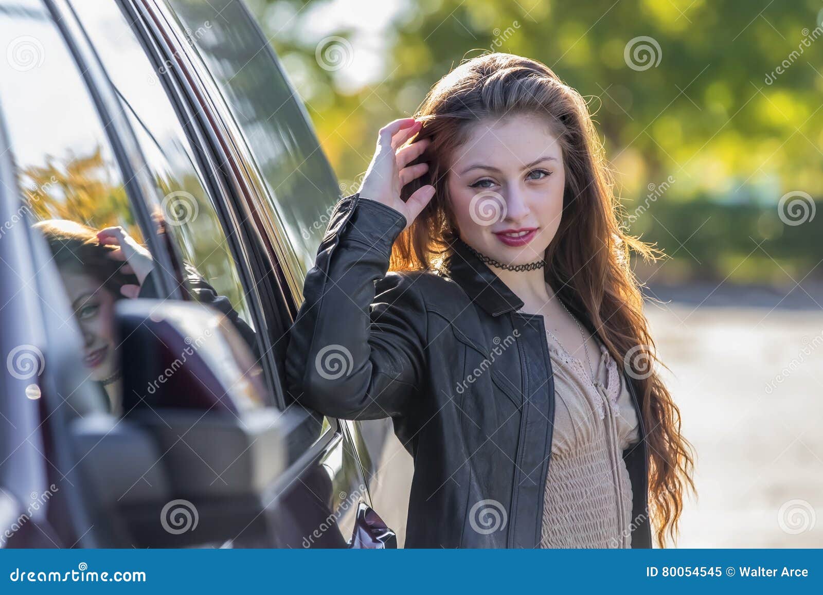 Brunette Coed Enjoying The Fall Foliage Stock Image