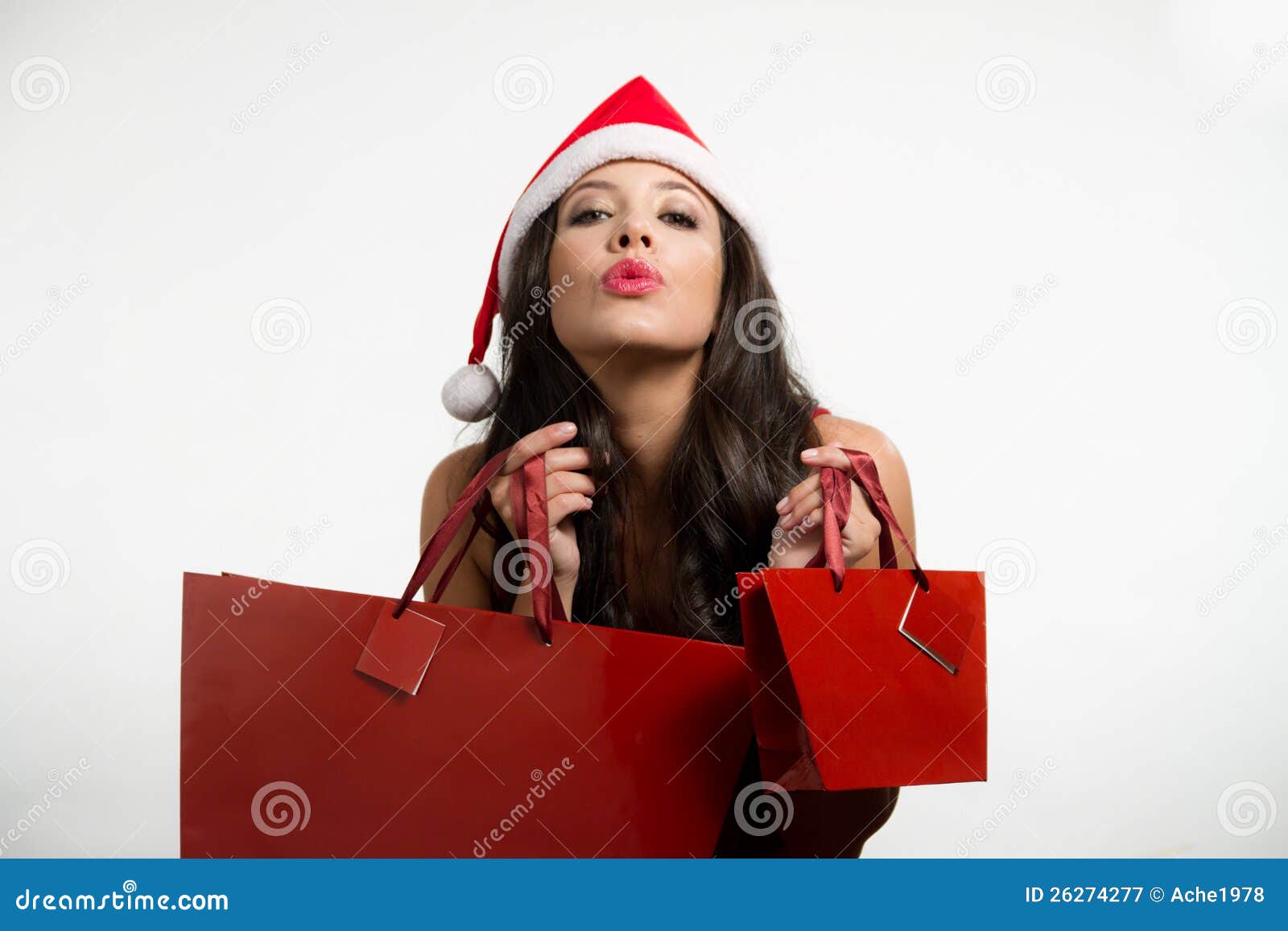 brunette holding christmas red shopping bags