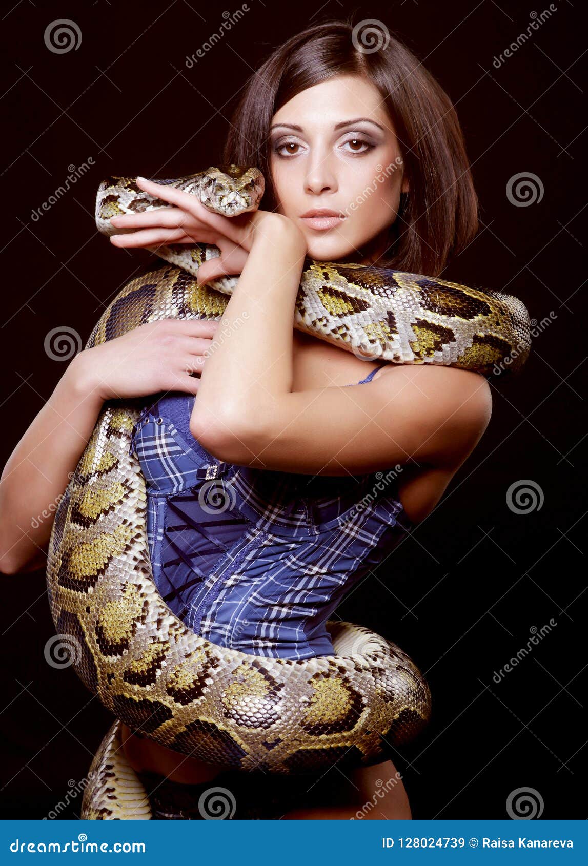 Brunette holding python stock image. Image of gorgeous - 128024739