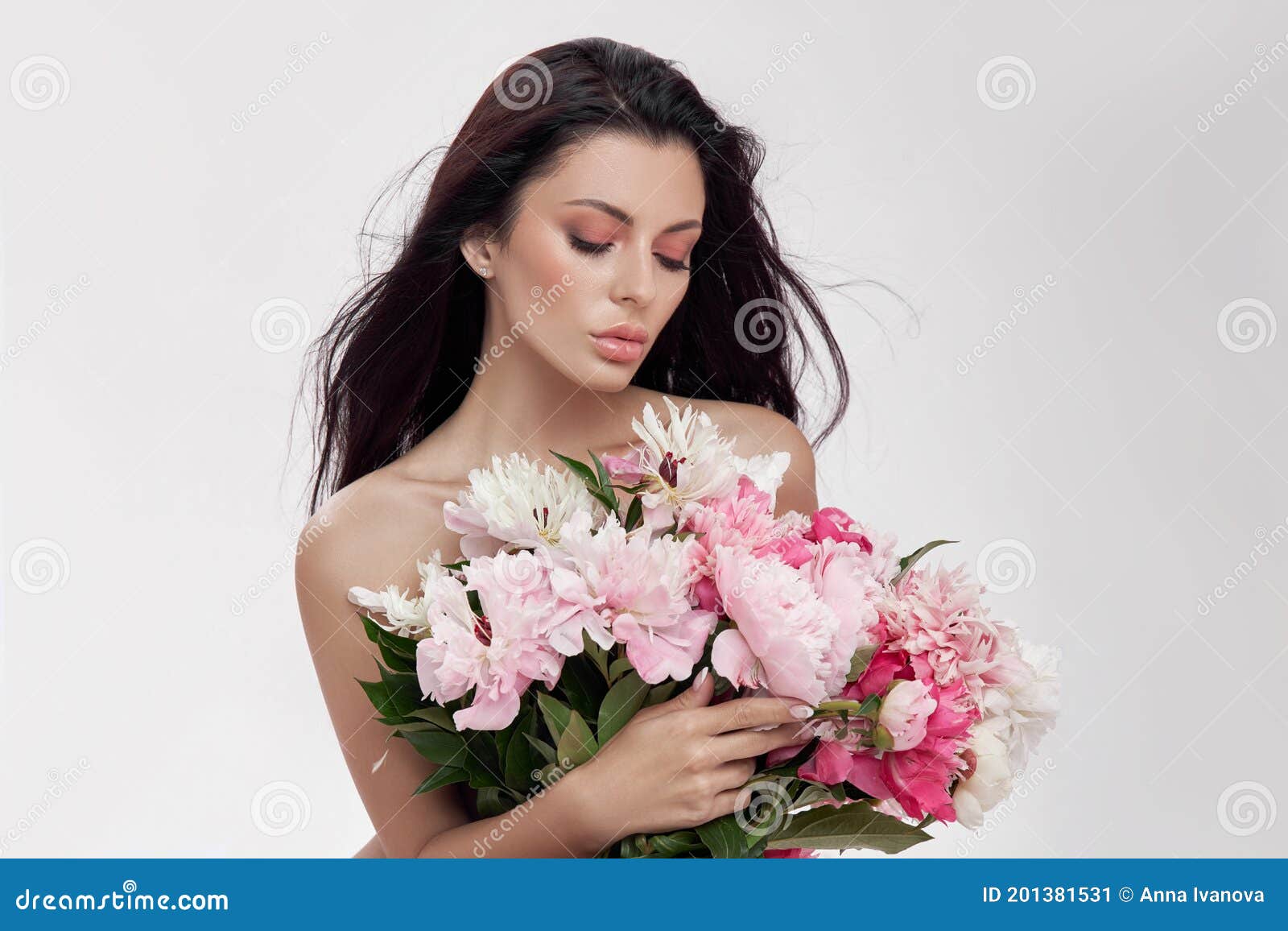Brunette Woman Holding A Large Bouquet Of Peony Flowers Perfect Makeup