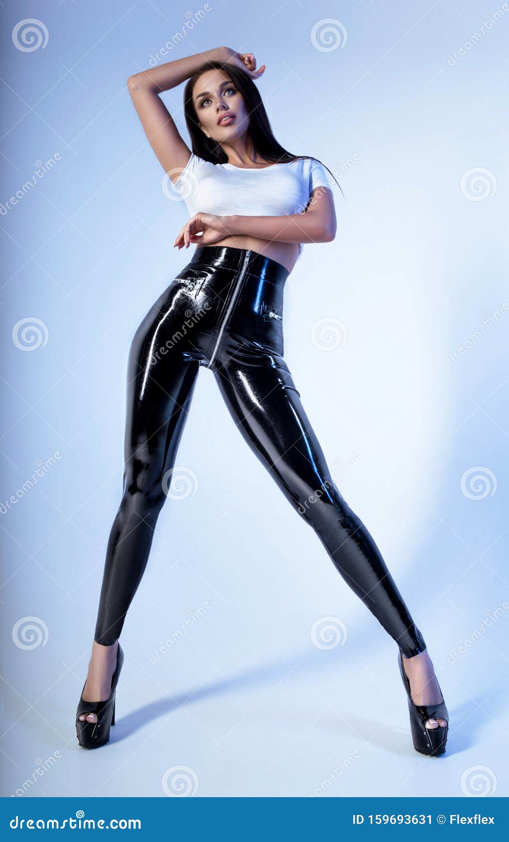 Brunette Woman in White Top and Vinyl Leggings Stock Image - Image