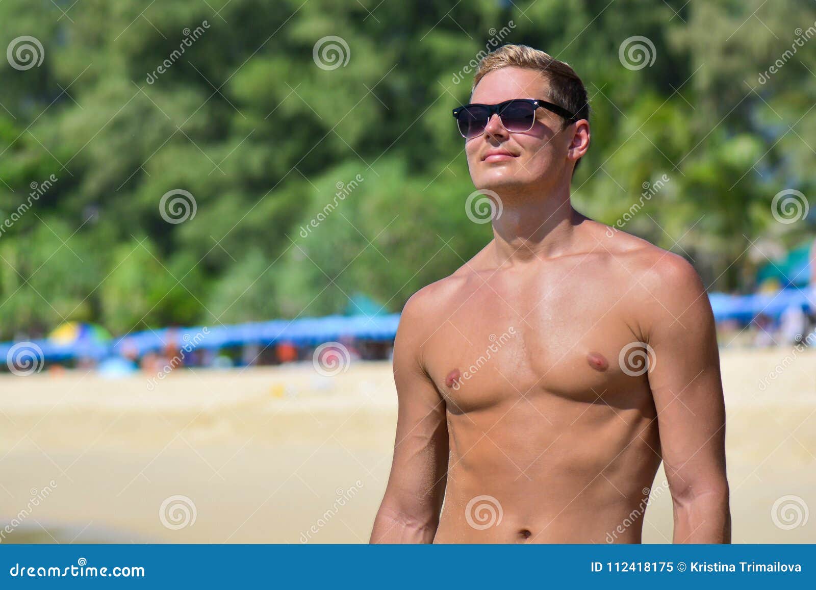 Caucasian Fit Man in Sun Glasses Posing at the Beach. Handsome ...