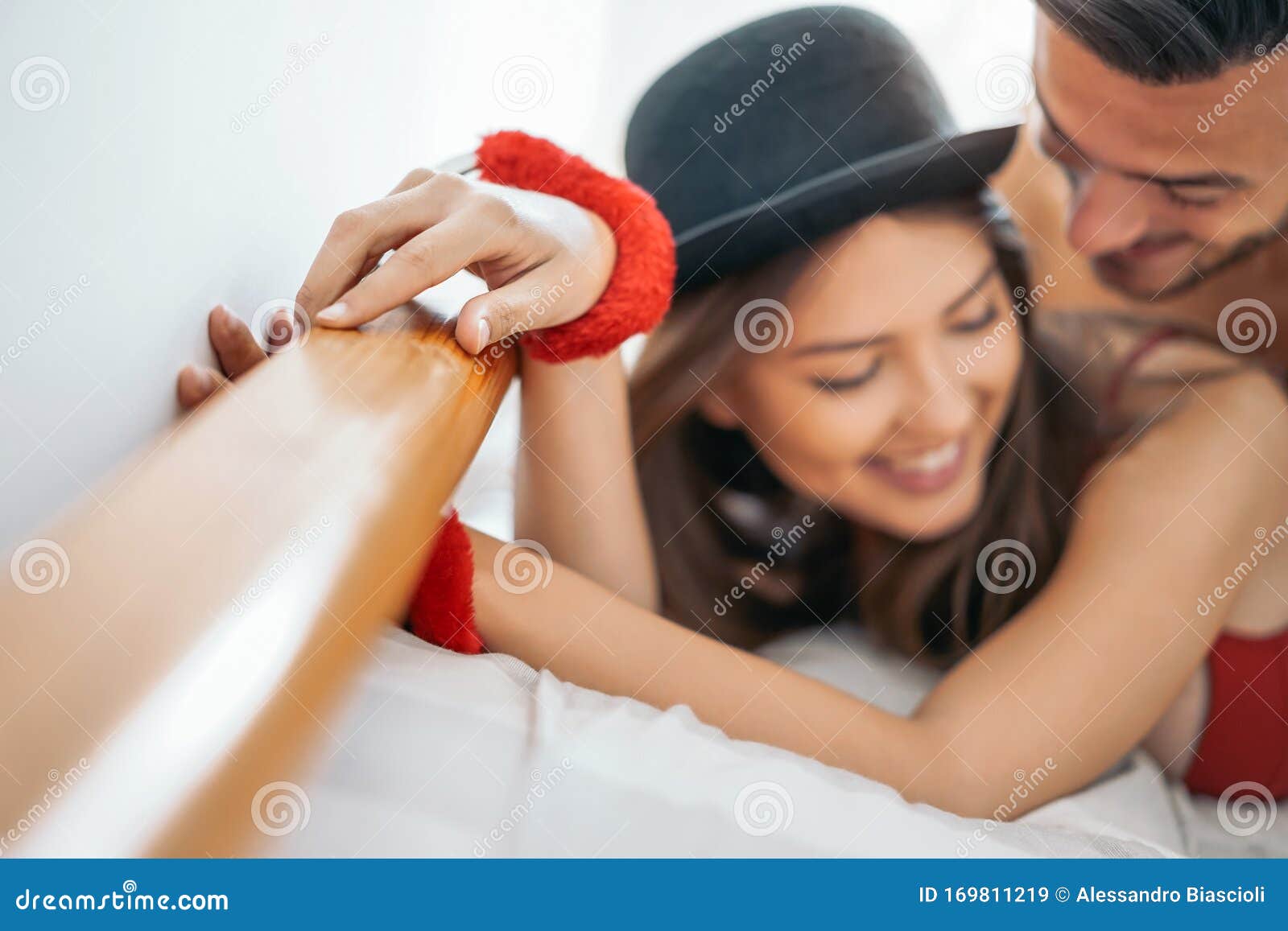 Couple Playing Love Domination Games in the Bed - Temptation Man and Woman Having Erotic Sex in the Bedroom Stock Image