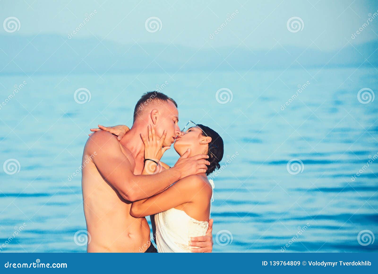 Couple In The Water Kissing And Embracing Stock Image Image Of