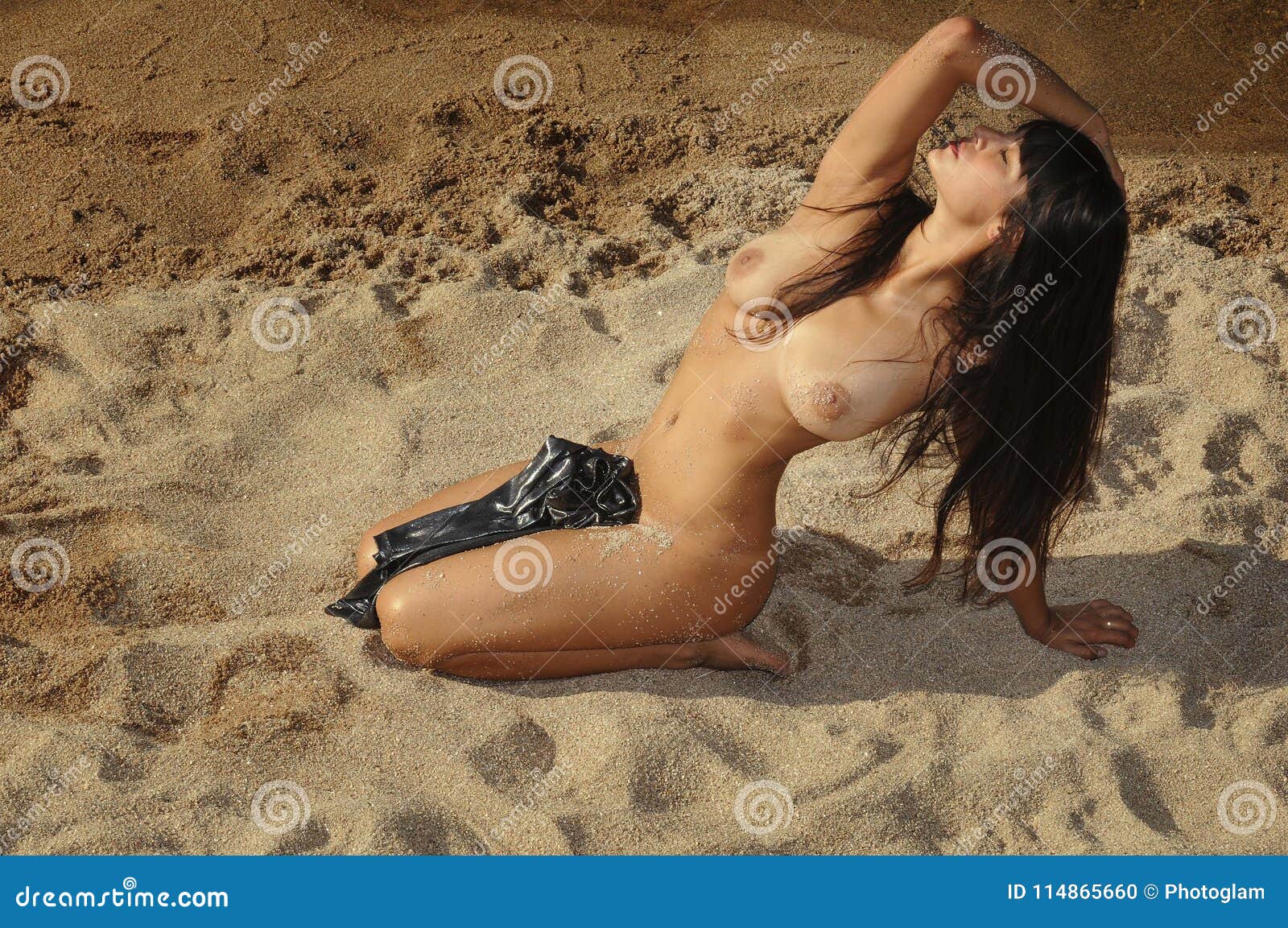 Sexy brunette girl Topless on the Beach