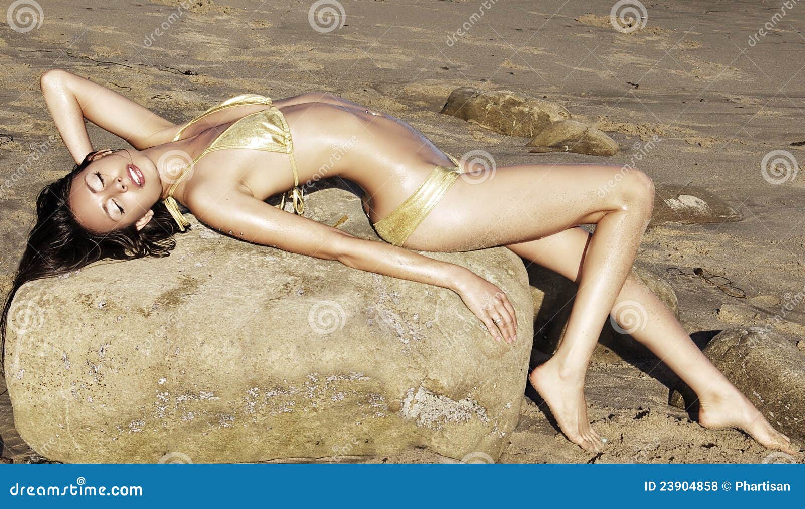 Exotic Slim Beauty Lying on Beach Stock Photo pic