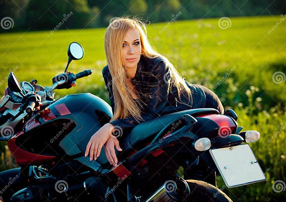 Fashion Female Biker Girl. Blonde Woman in Leather Jacket Sitting on ...