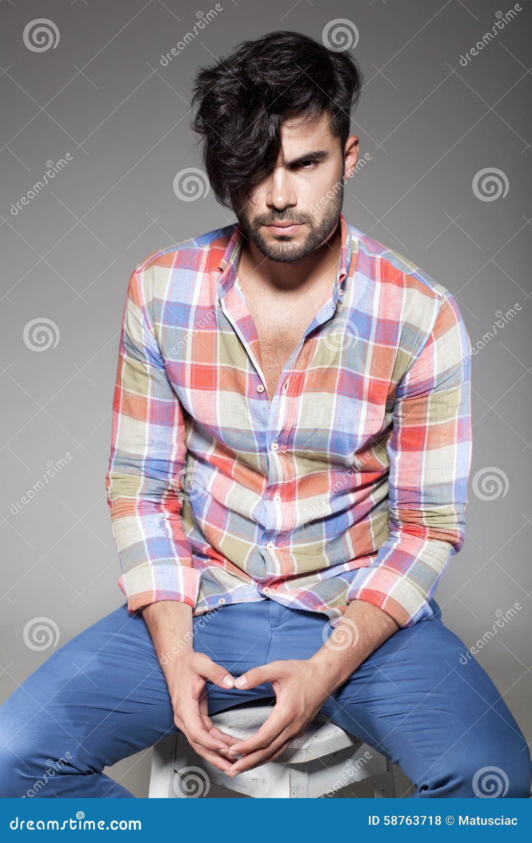 Young model poses in casual clothes isolated against a white background  Stock Photo - Alamy