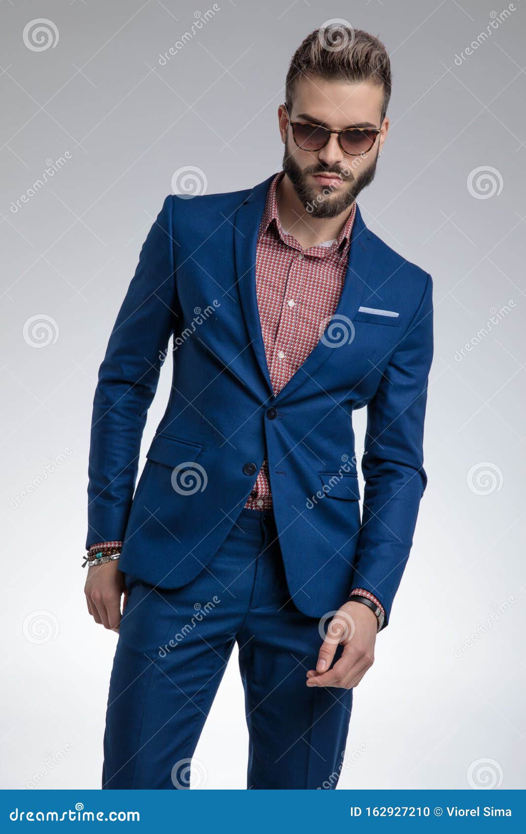 Fashion Model in Blue Suit Standing in a Fashion Pose Stock Photo ...