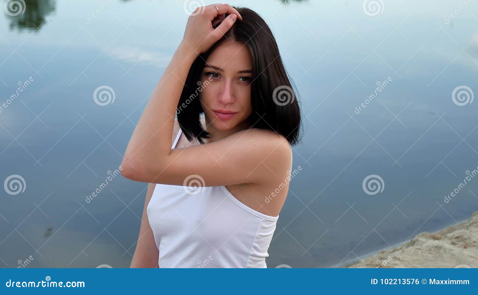 Girl on the Beach in Evening, the Sunset, the Summer Heat Outdoor Stock