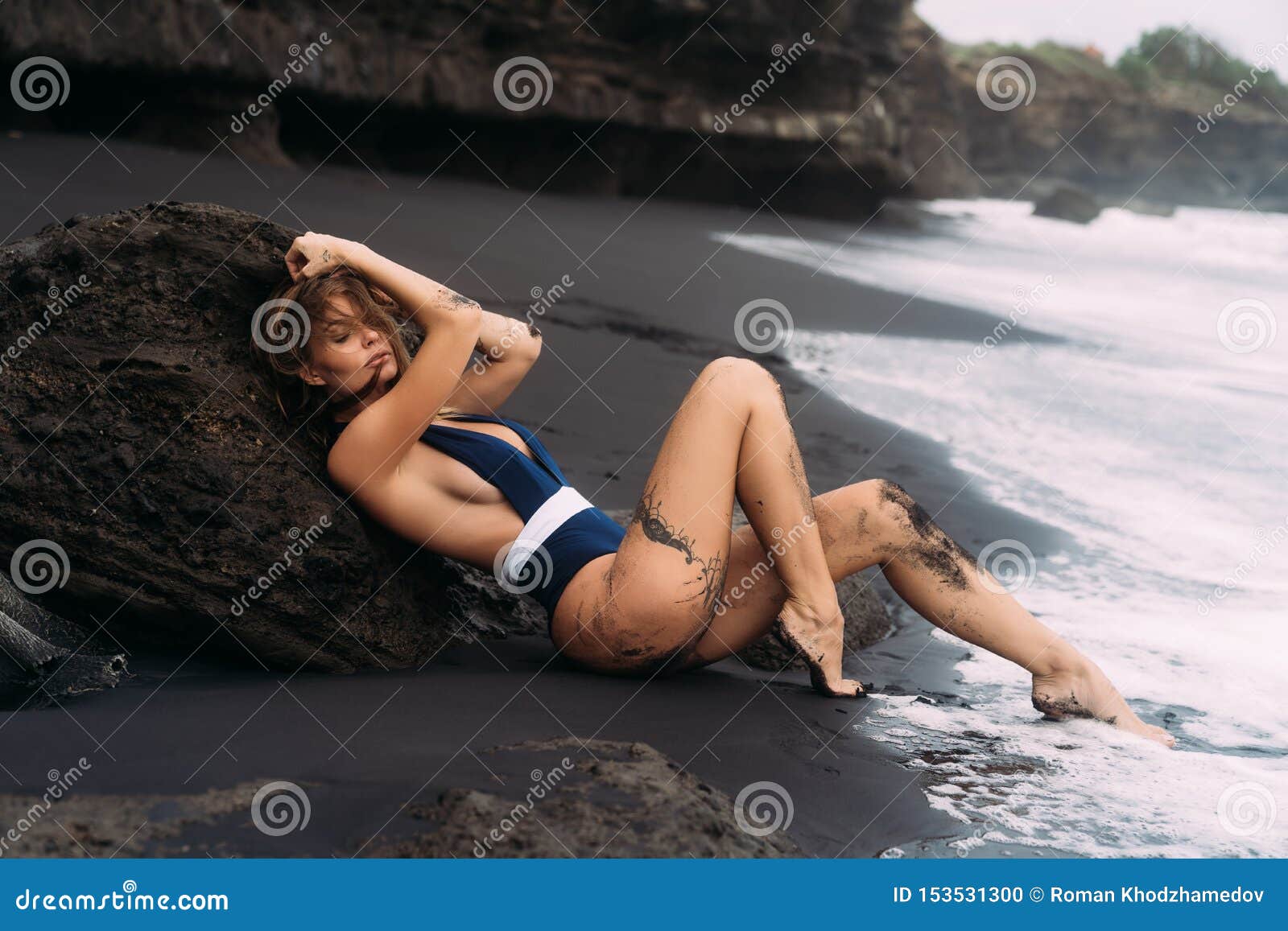 Girl with Big Breasts in Blue Swimwear Relaxing at Beach with Black Sand.  Stock Photo - Image of lifestyle, beach: 153531300