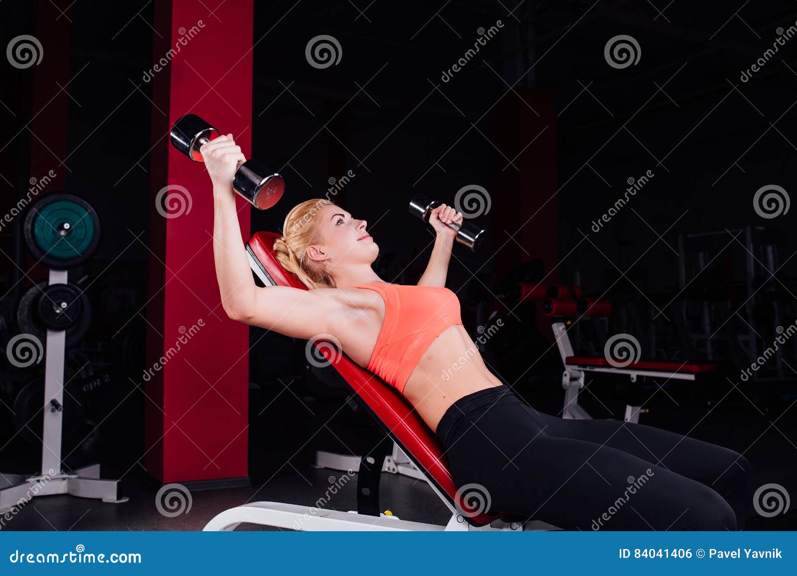 Girl Doing Exercises in Her Pectoral Muscle. Fitness with Dumbbells in the  Gym. Nice Cute Female Stock Photo - Image of female, attractive: 84041406