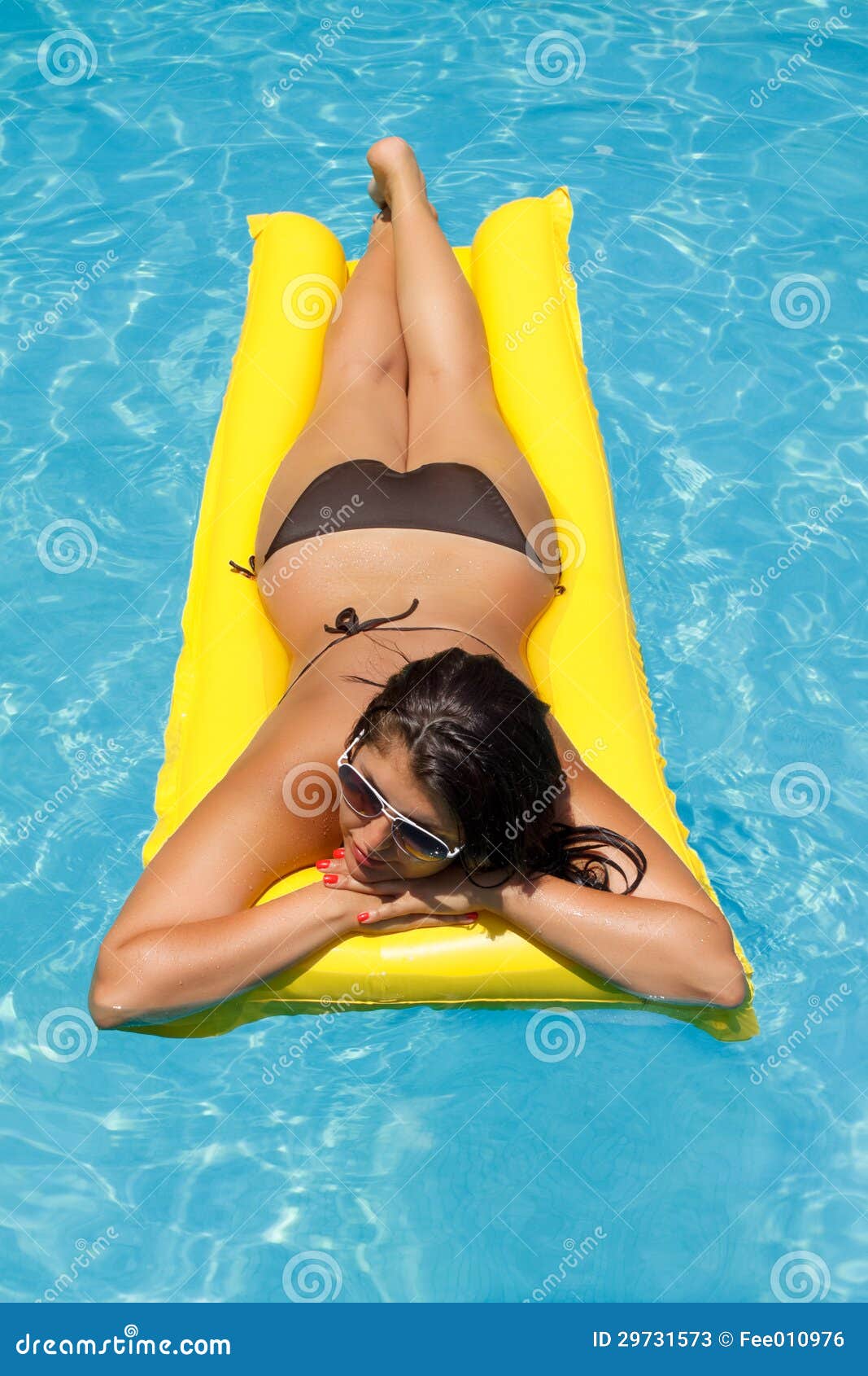 Woman Floating On Mattress Stoc