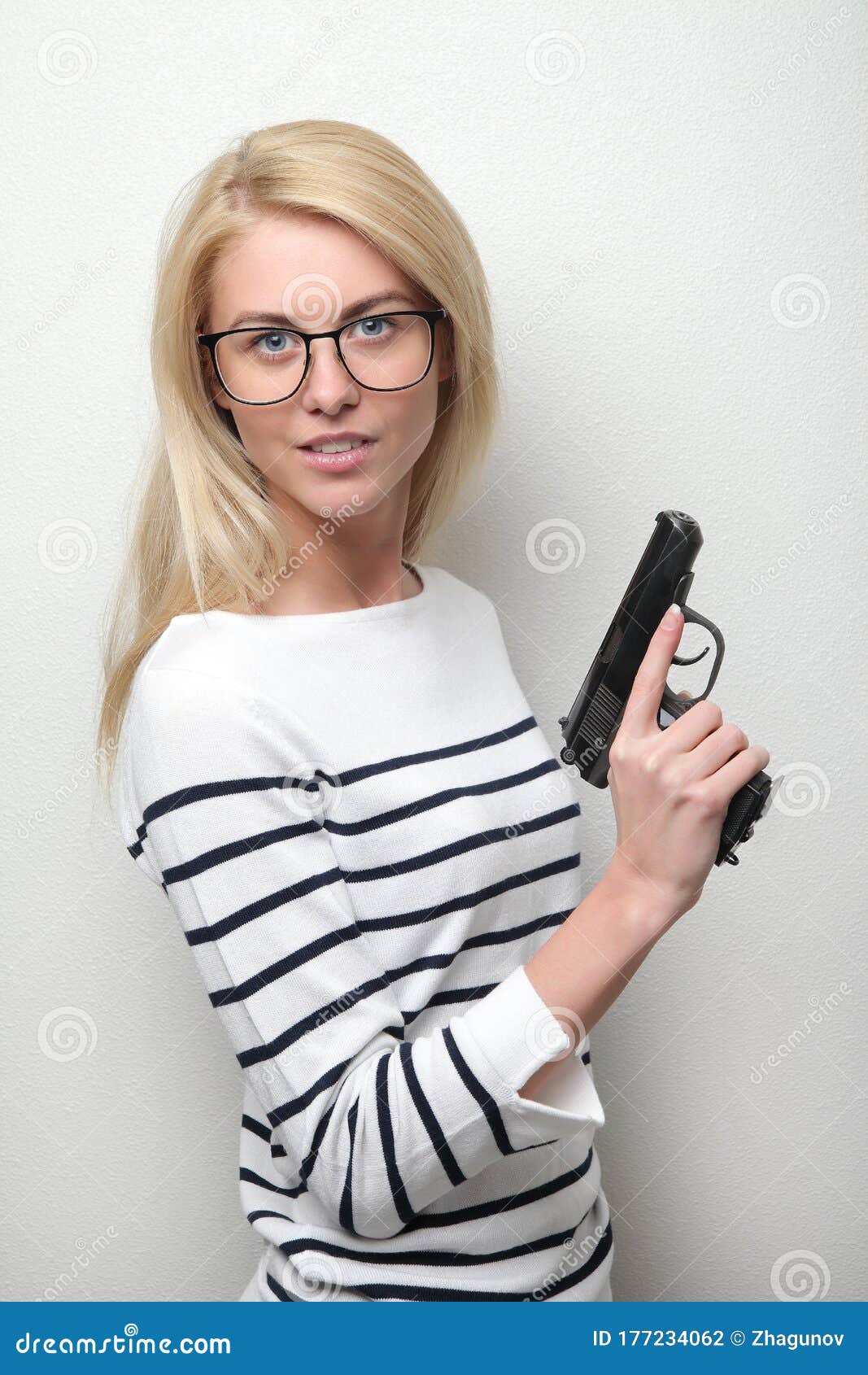 Girl holding gun stock photo. Image of cosmetics, hairstyle - 177234062