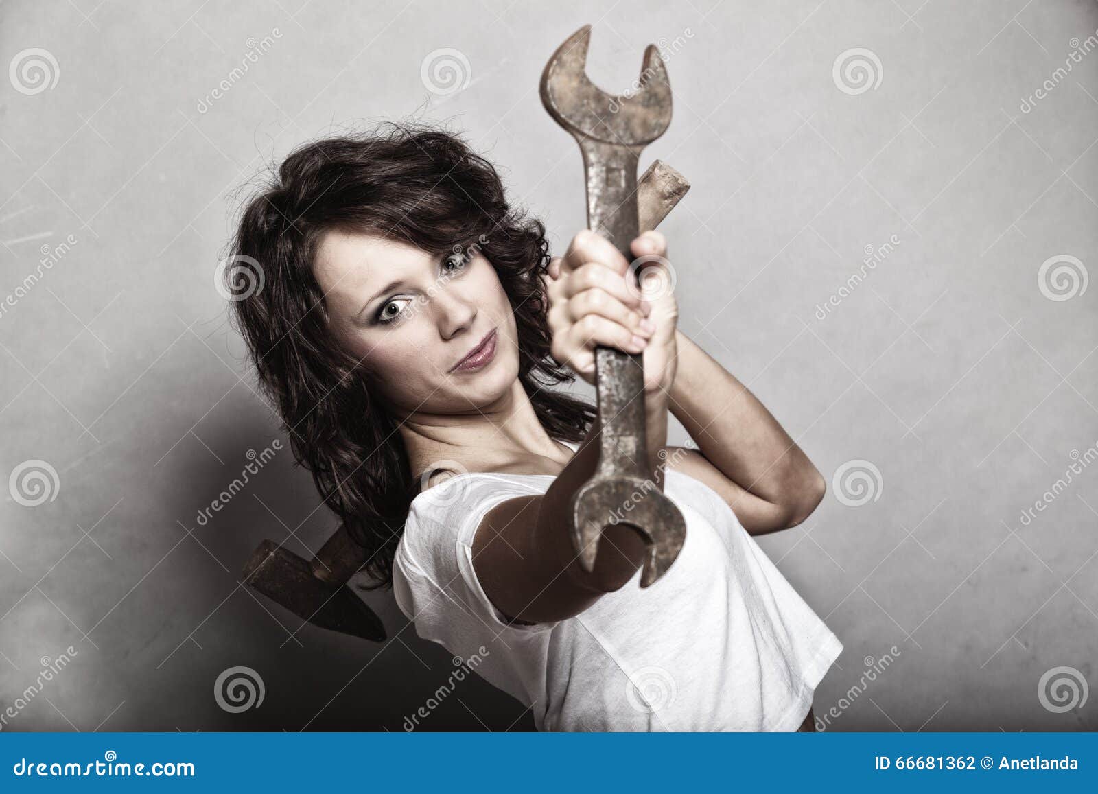 Girl Holding Wrench Spanner Tool Stock Photo