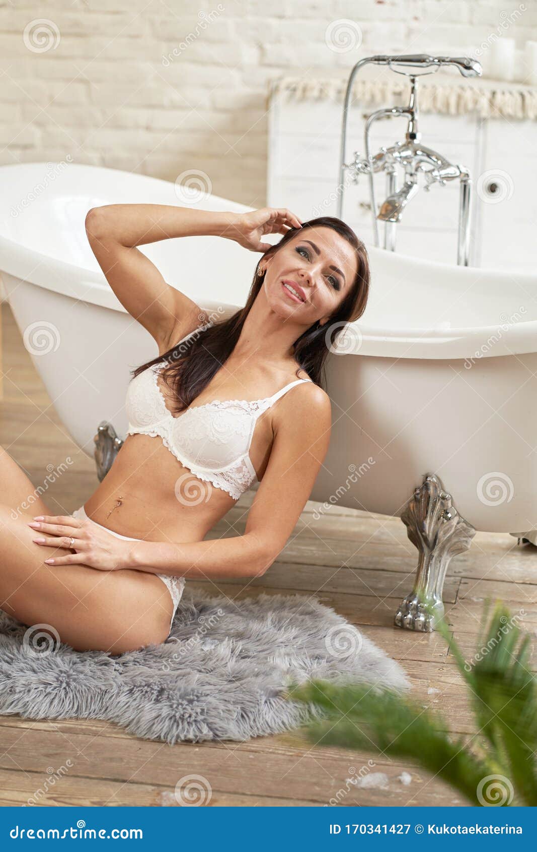 Woman in Bathroom in Bra and Panties Stock Photo