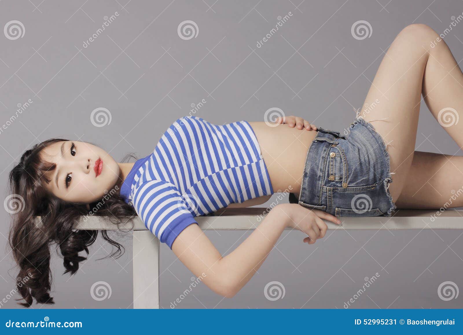 Young girl in hot pants Stock Photo by ©Zveiger 83691648