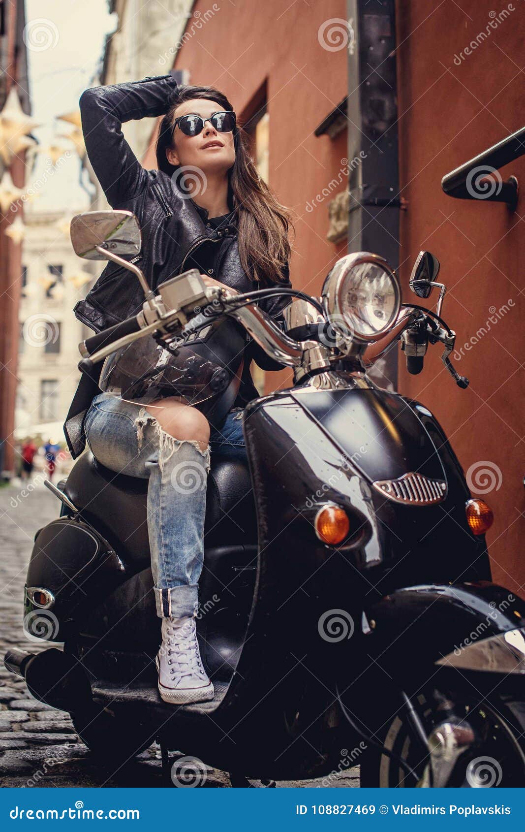 Young cheerful girl driving scooter in in city. Portrait of a young and  stylish woman with a moped Stock Photo by ©Estradaanton 251086508