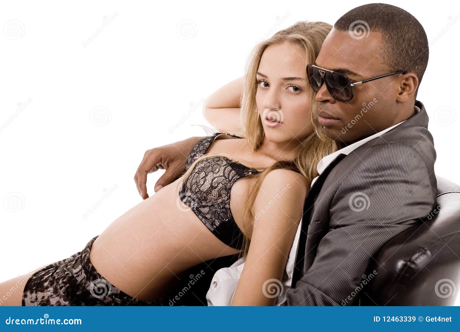Lady Lying on the Young Business Man in Couch Stock Image photo