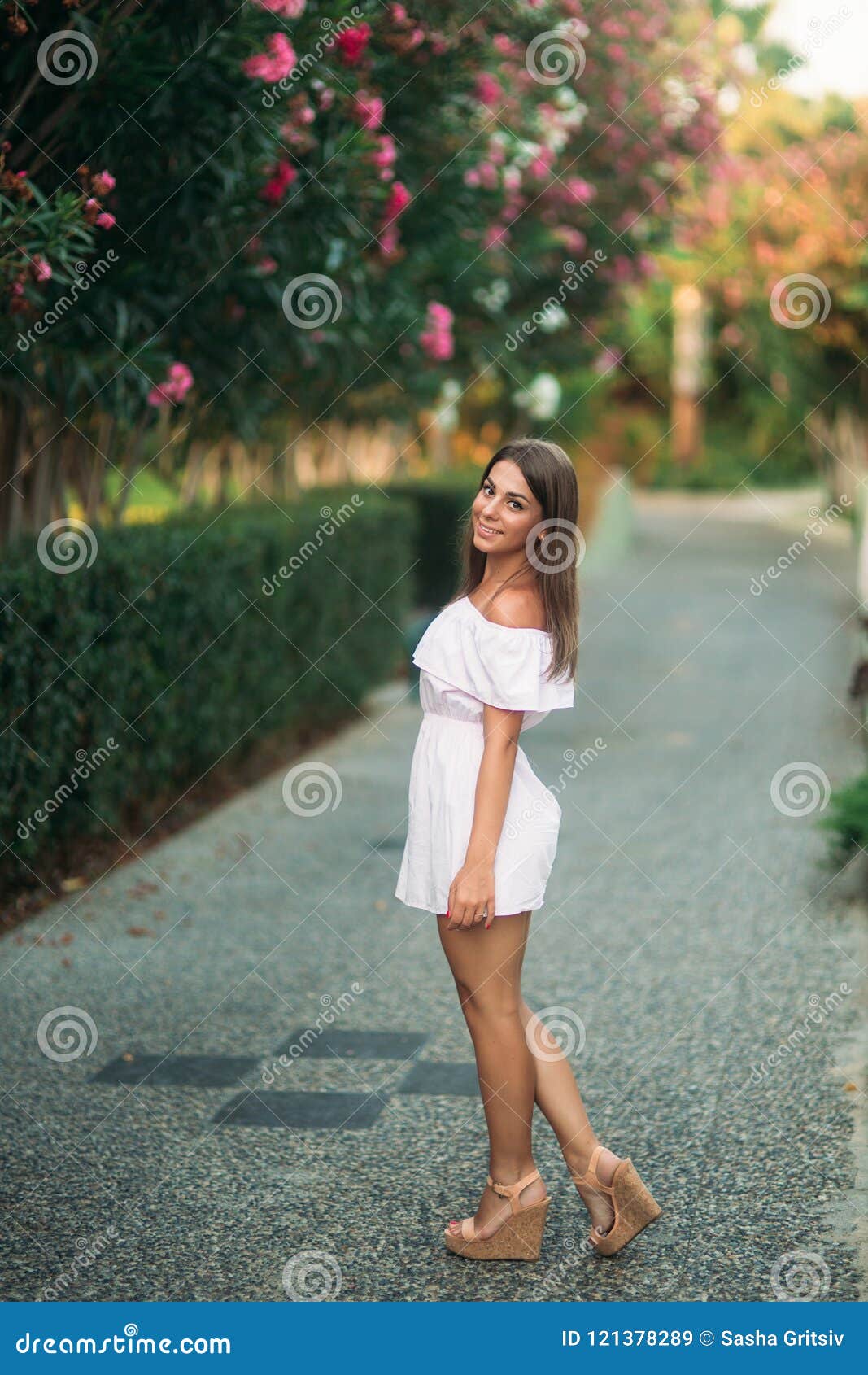 Lady in White Dress Standing Near the Flowers Stock Image - Image of ...