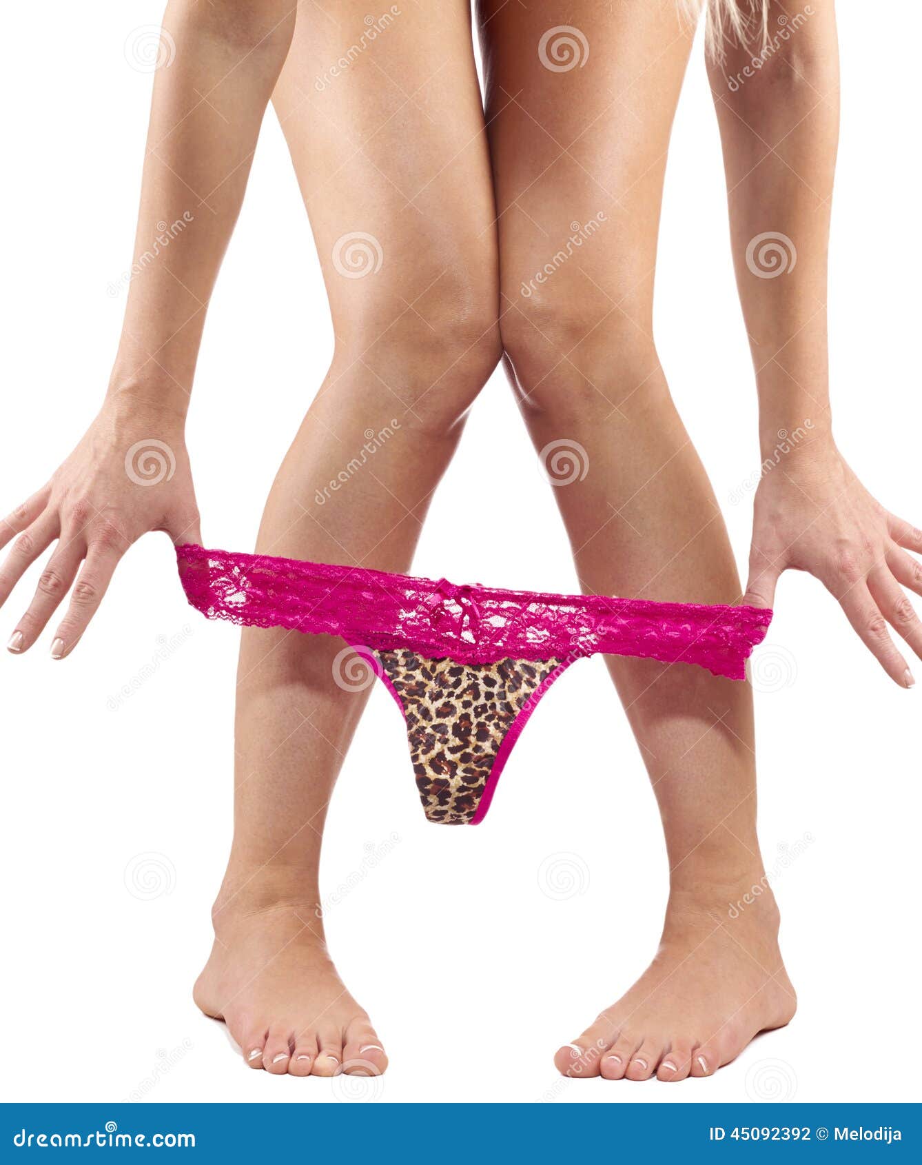 Legs pulling panties down. stock photo. 