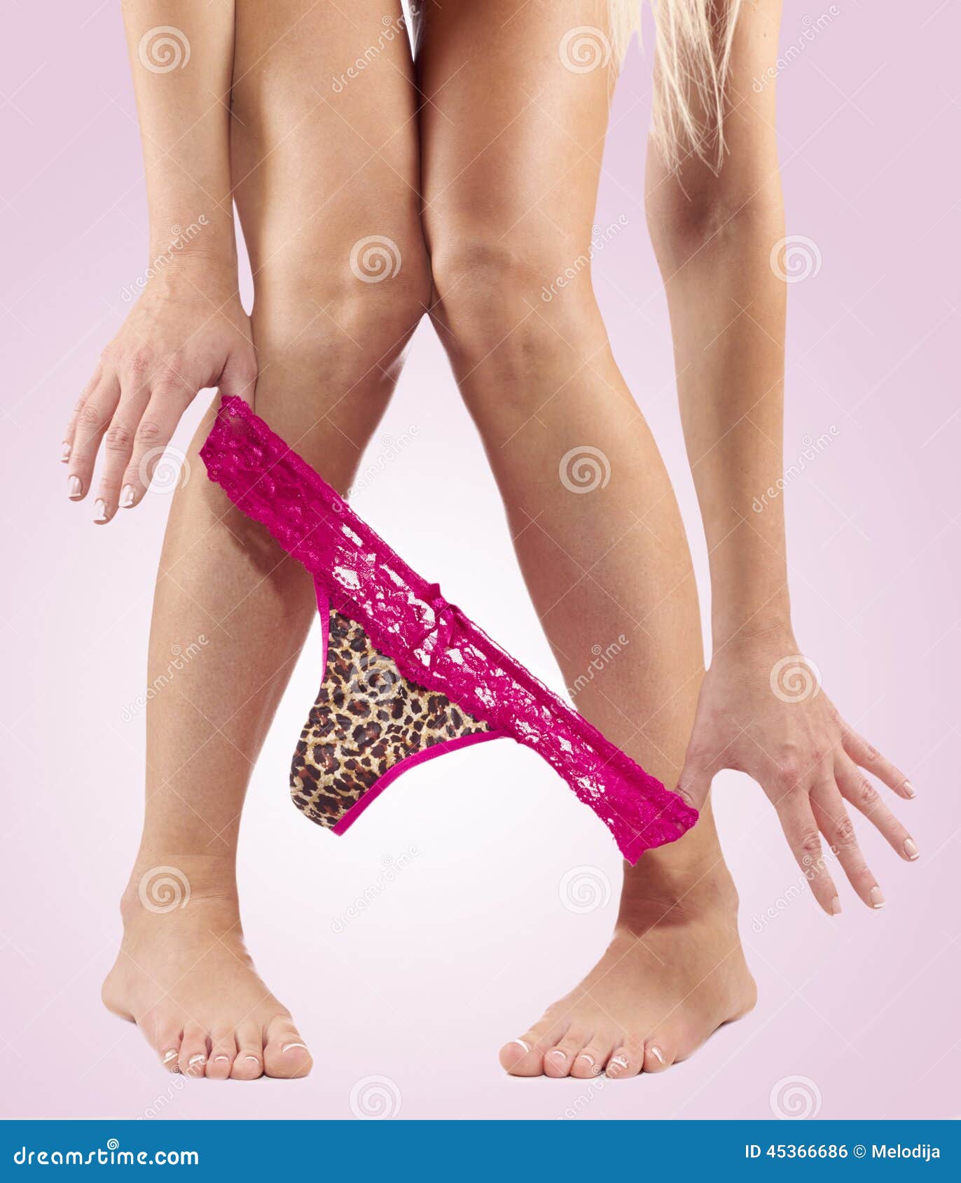 Legs pulling panties down. stock photo. Image of panties - 45366686