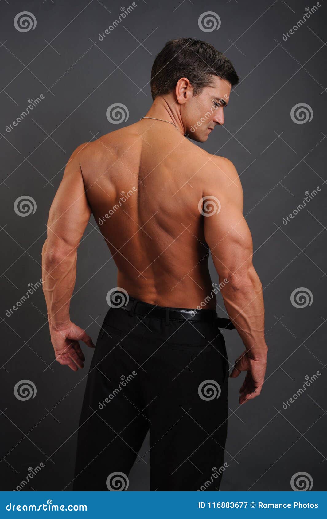 Back Shot Of Shirtless Muscular Young Man, Relaxed Pose, Turning Around To  Look At Camera, Isolated On White Stock Photo, Picture and Royalty Free  Image. Image 38868208.