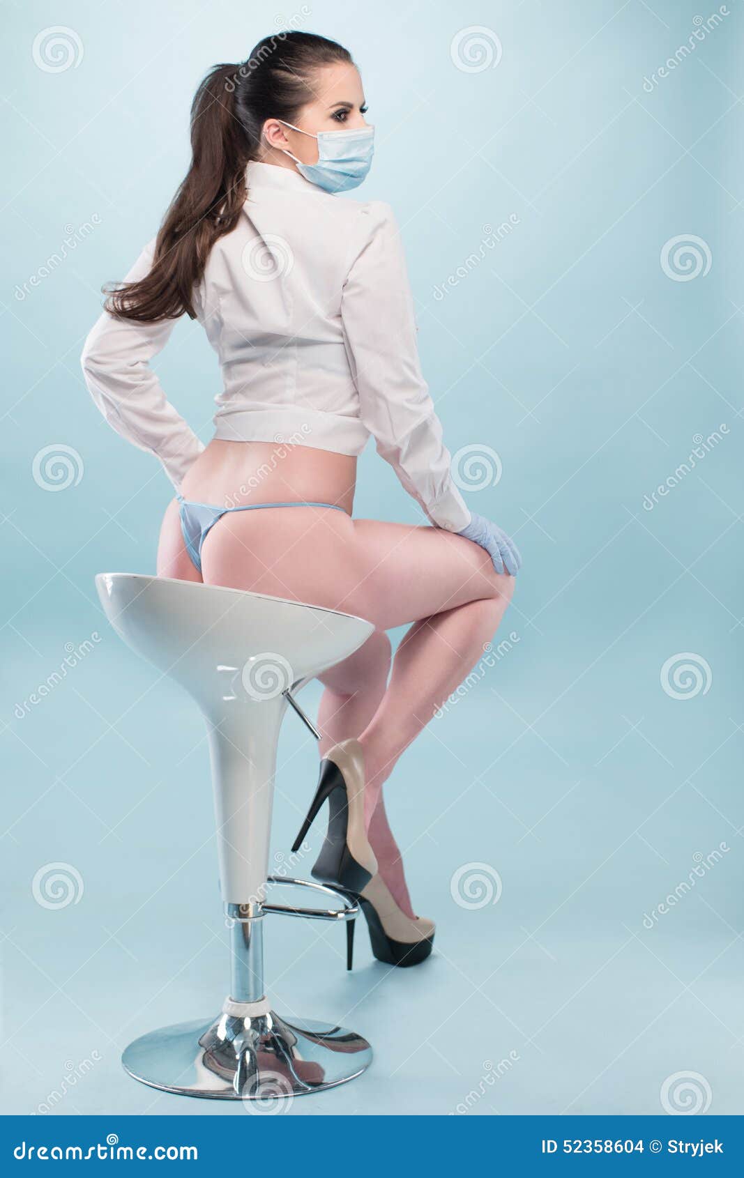 Nurse in Shirt and Panties Sitting on a Stool Stock Photo - Image