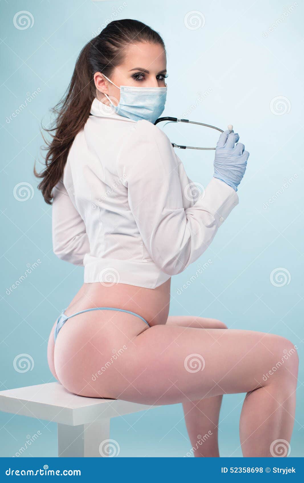 Nurse in Shirt and Panties Sitting on a Stool Stock Photo - Image