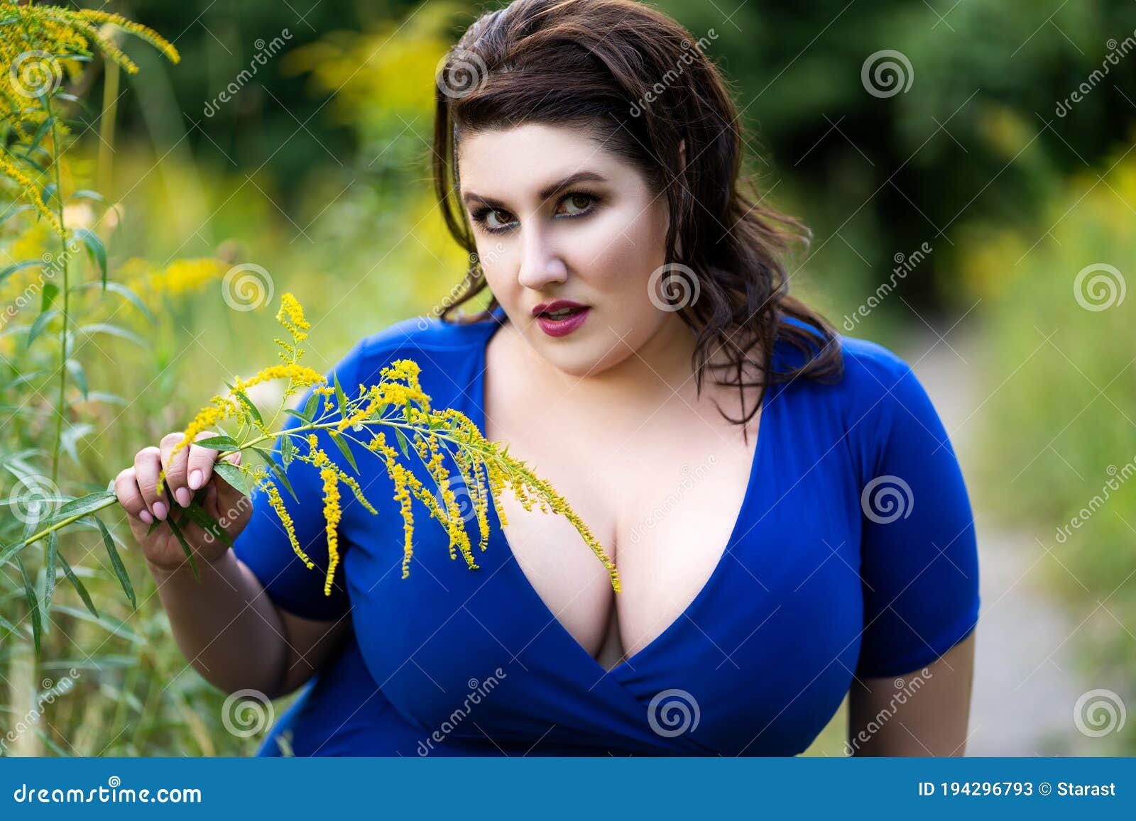 Plus Size Fashion Model in Blue Dress with a Deep Neckline Outdoors,  Beautiful Fat Woman with Big Breasts in Nature Stock Image - Image of  clothing, model: 194296889