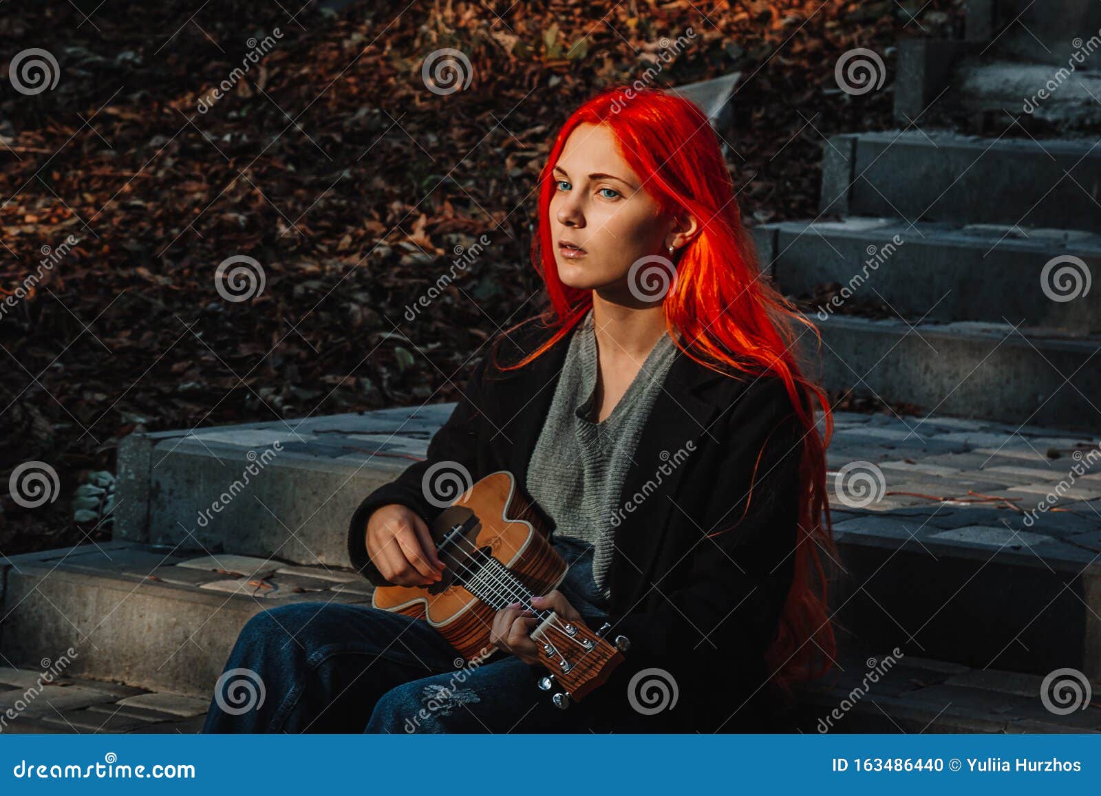 Redhead Girl With Long Hair Plays The Ukulele Perfect