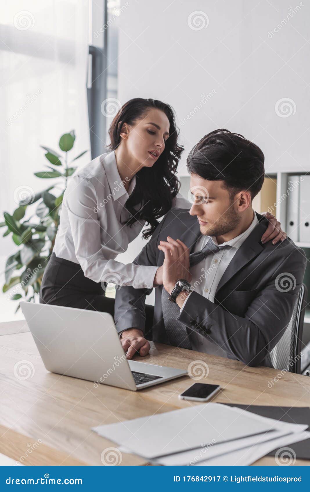 Secretary Hugging Handsome Boss while Seducing Stock Image