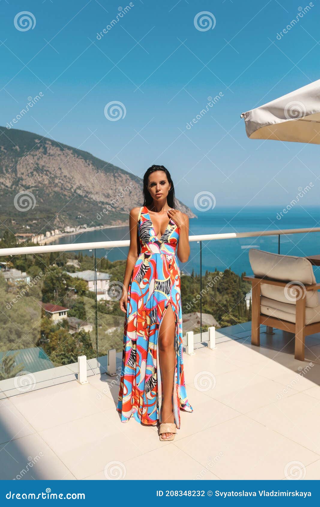 Woman With Dark Hair In Elegant Dress Posing At The Balcony With Sea View Stock Photo Image Of