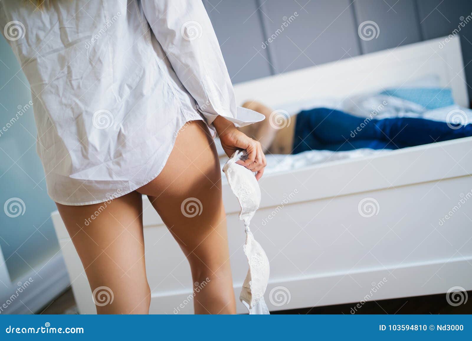 Woman Getting Ready for Sex in Bedroom Stock Photo