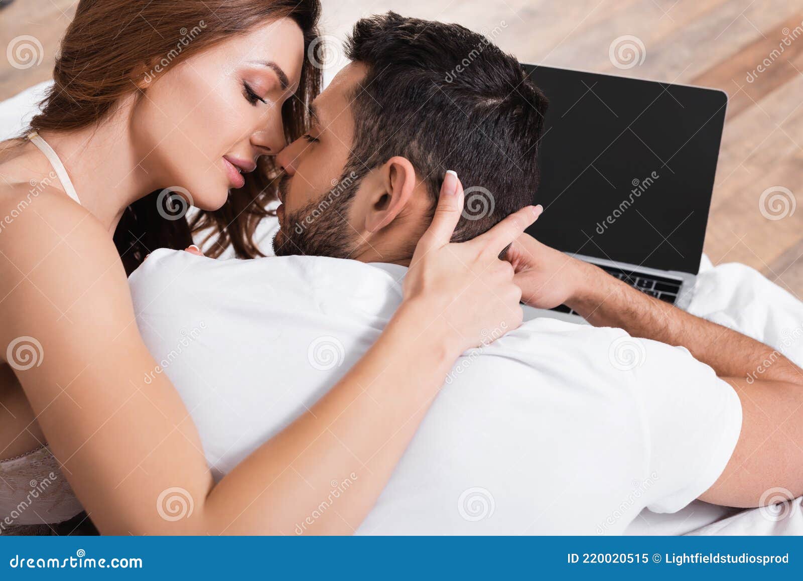 Woman Kissing Boyfriend Near Blurred Stock Image pic