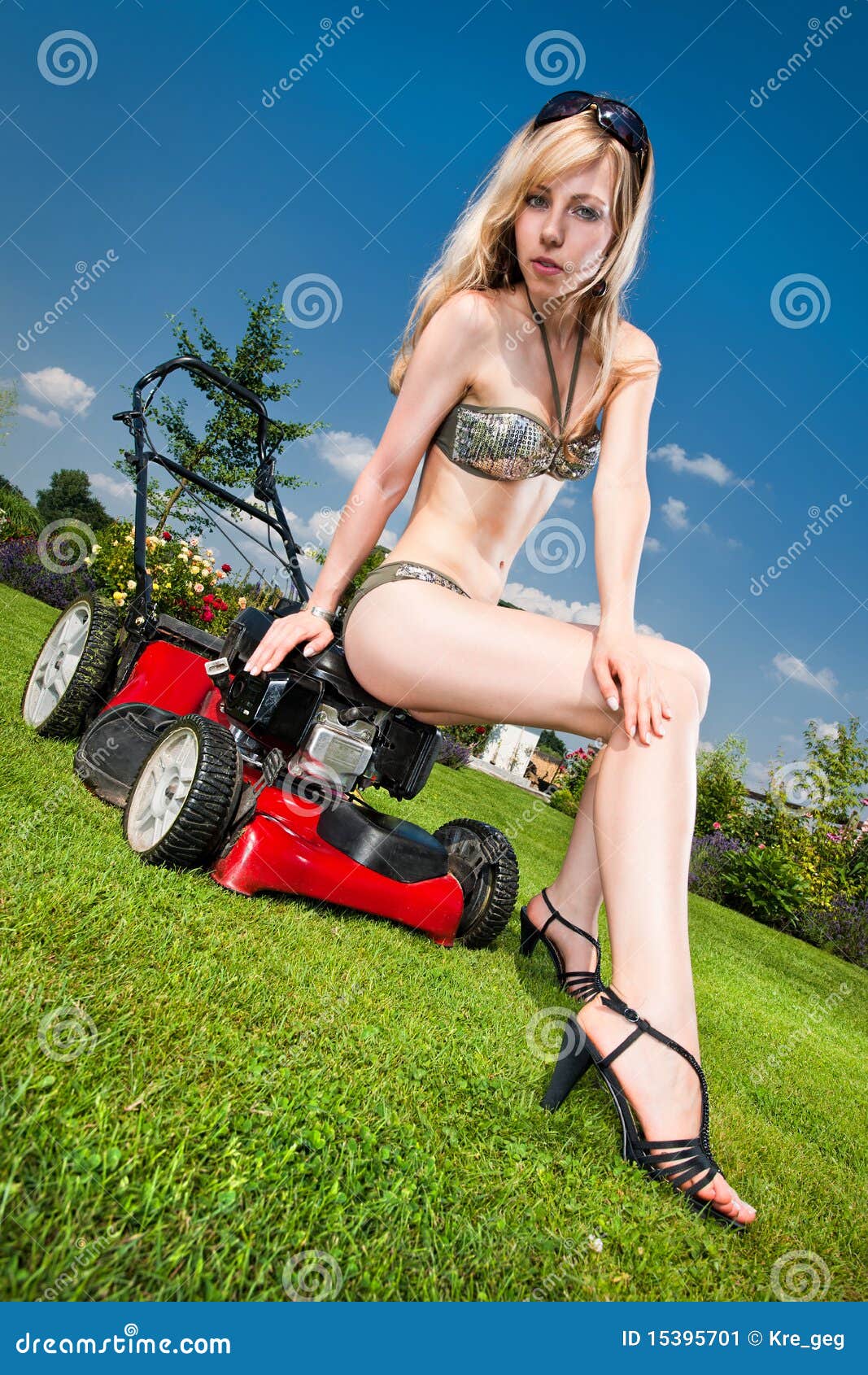 Sexy Mowing Sexy Woman Sitting A Lawn Mower On White Background Stock Picture And Royalty Free