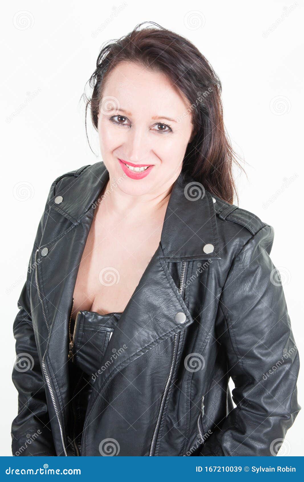 Woman in Leather Clothes Posing Against White Studio Wall Stock Image ...