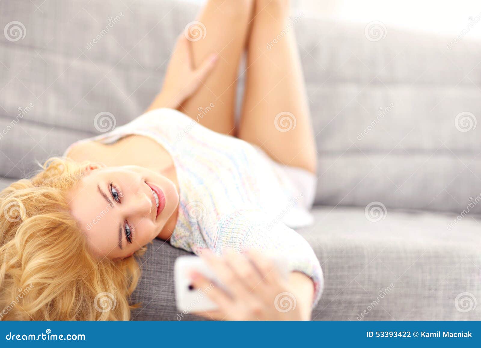 Woman Lying On Sofa And Taking Selfie Stock Photo Image Of Lying